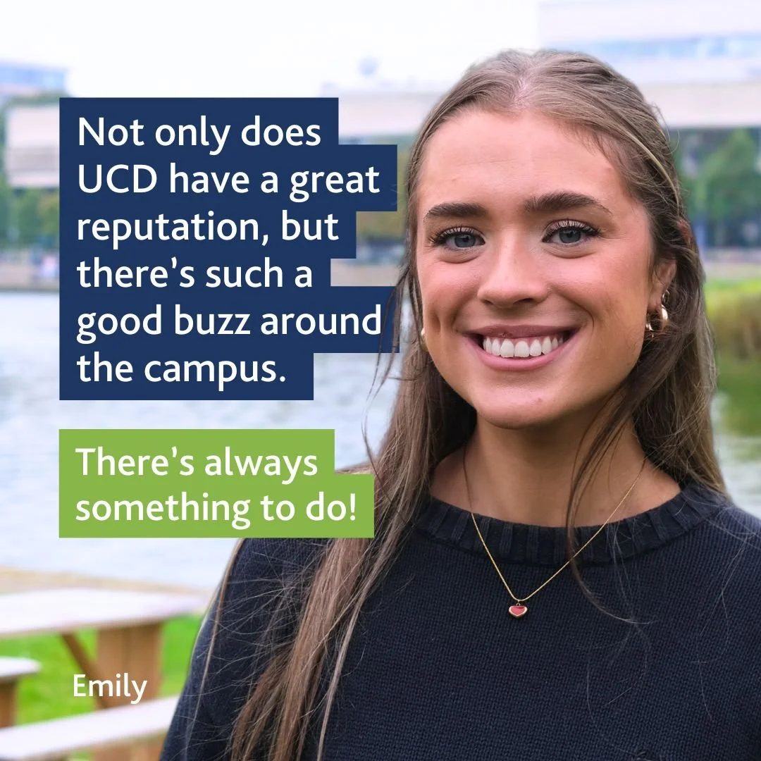 A young woman with long brown hair and earrings smiling outdoors near a water body with trees and a bridge in the background. The image includes quotes about UCD's reputation and campus life, with her name Emily displayed.