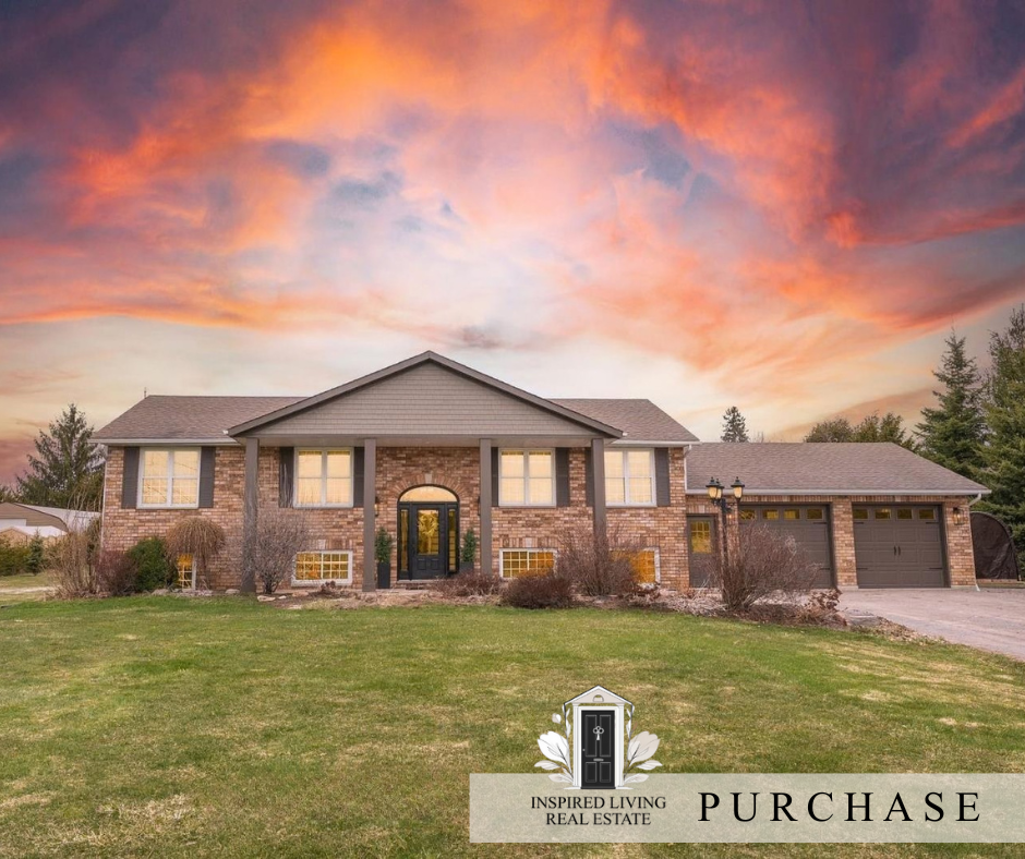 A large two-story brick house with gray trim and a three-car garage, set against a vibrant sunset sky with pink, orange, and purple clouds, surrounded by a grassy lawn and some bushes.