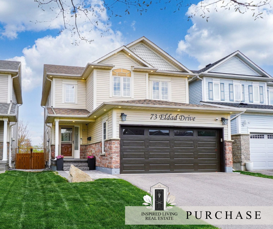 A two-story suburban house with beige siding, stone accents, and a two-car garage. The front yard is landscaped with green grass and potted flowers. There are neighboring houses on either side and a blue sky above.