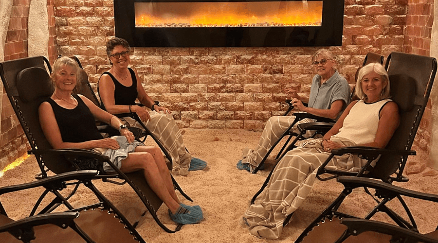group of women sitting in chairs and smiling in himalayan