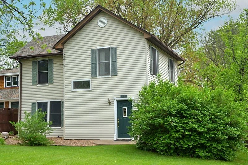 Green back door to The Retreat Home