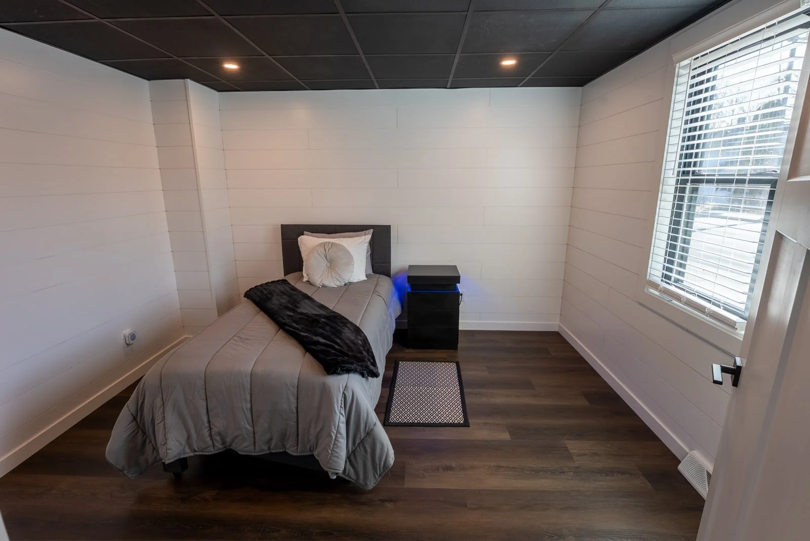 Bedroom with twin bed in The Donovan home