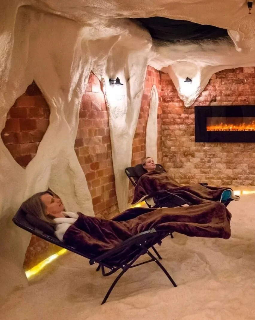 two women reclined in chairs with blankets on in the himalayan salt cave