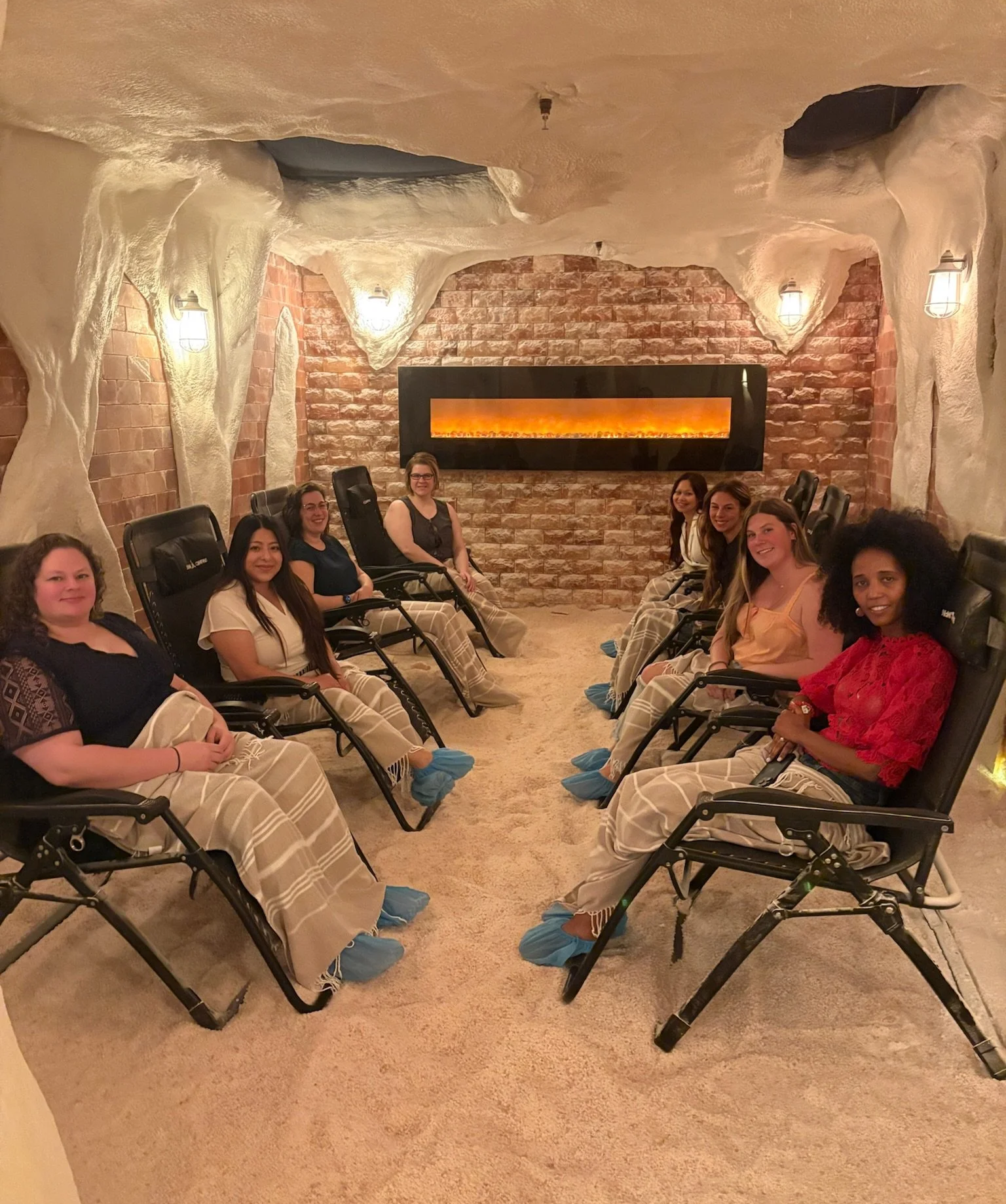 8 women relaxing together in the Himalayan Salt Cave