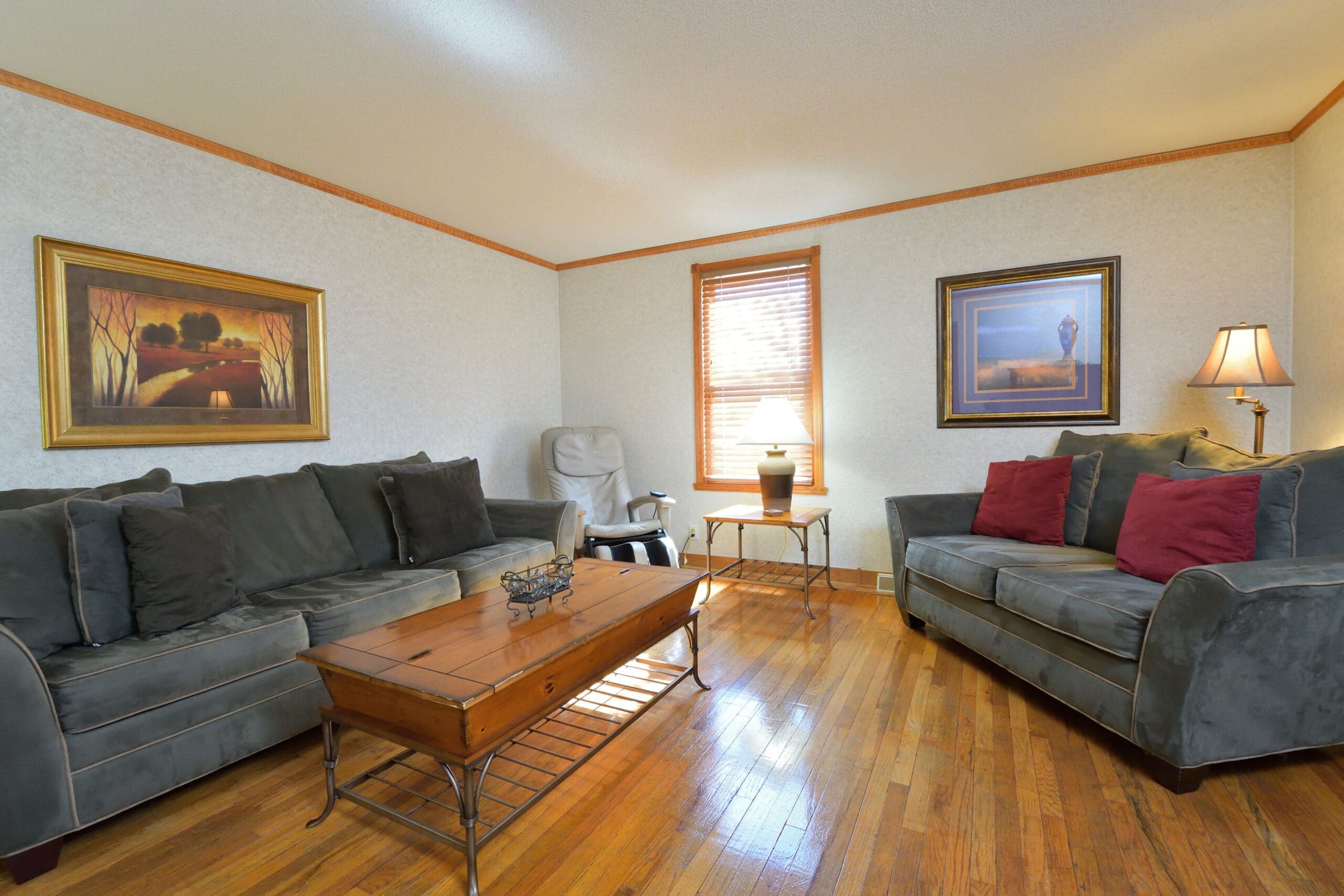 Living room with two couches, chair, and coffee table in The Retreat Home
