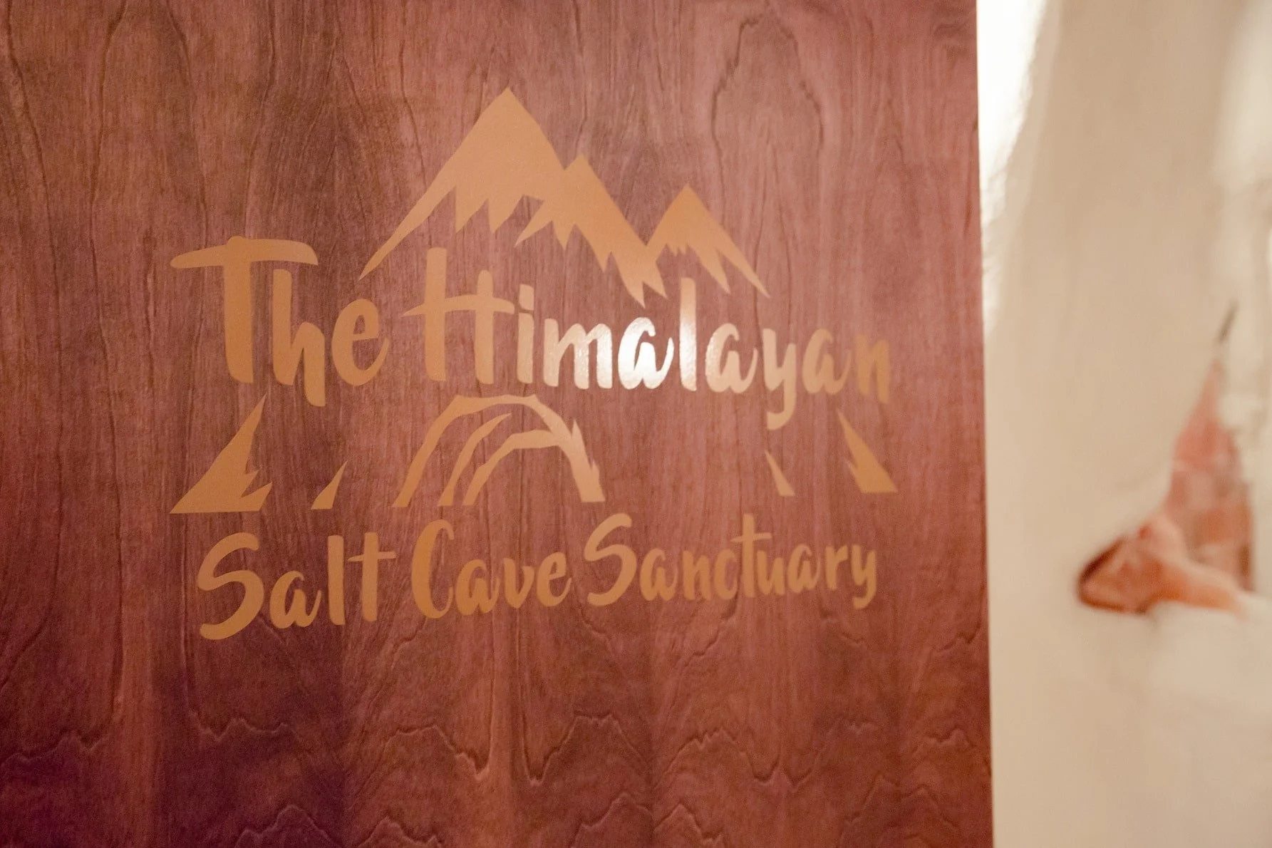 himalayan salt cave sanctuary sign on door