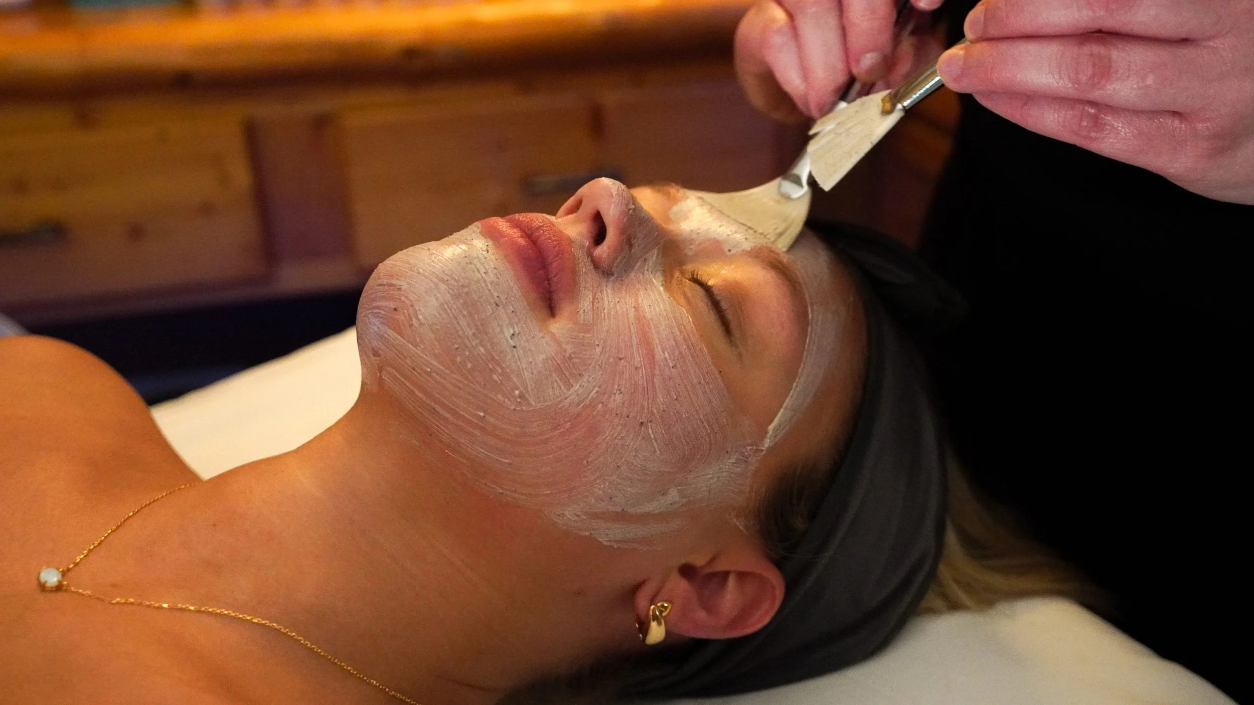 woman getting facial at spa