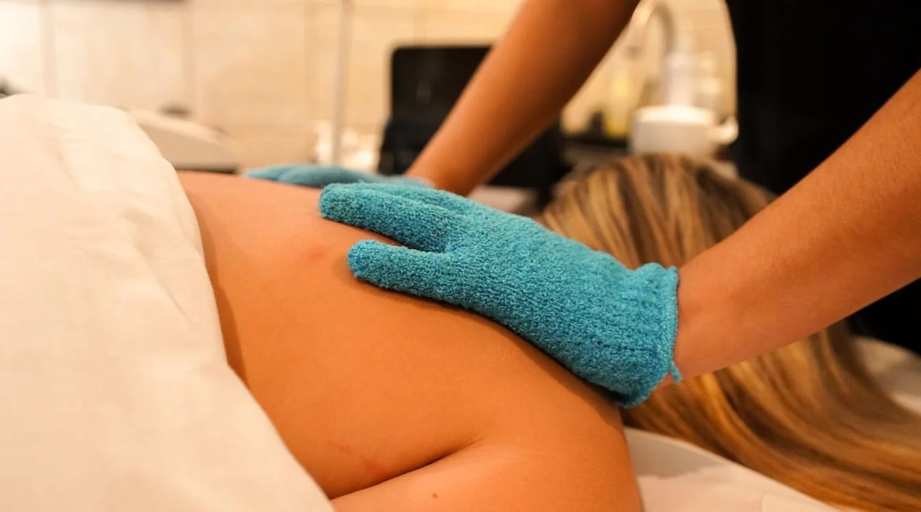 back massage with blue gloves