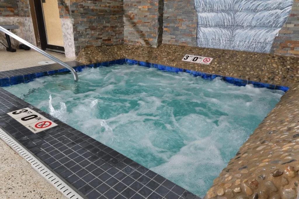 hot tub with jets on inside spa