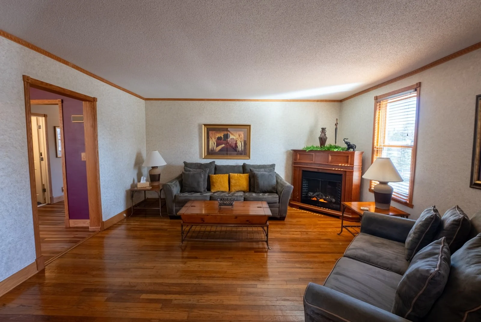 Living room with fireplace in The Retreat Home