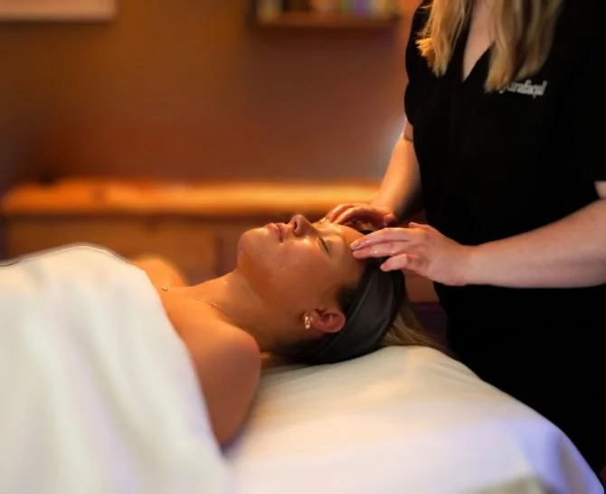 woman lying on back receiving massage
