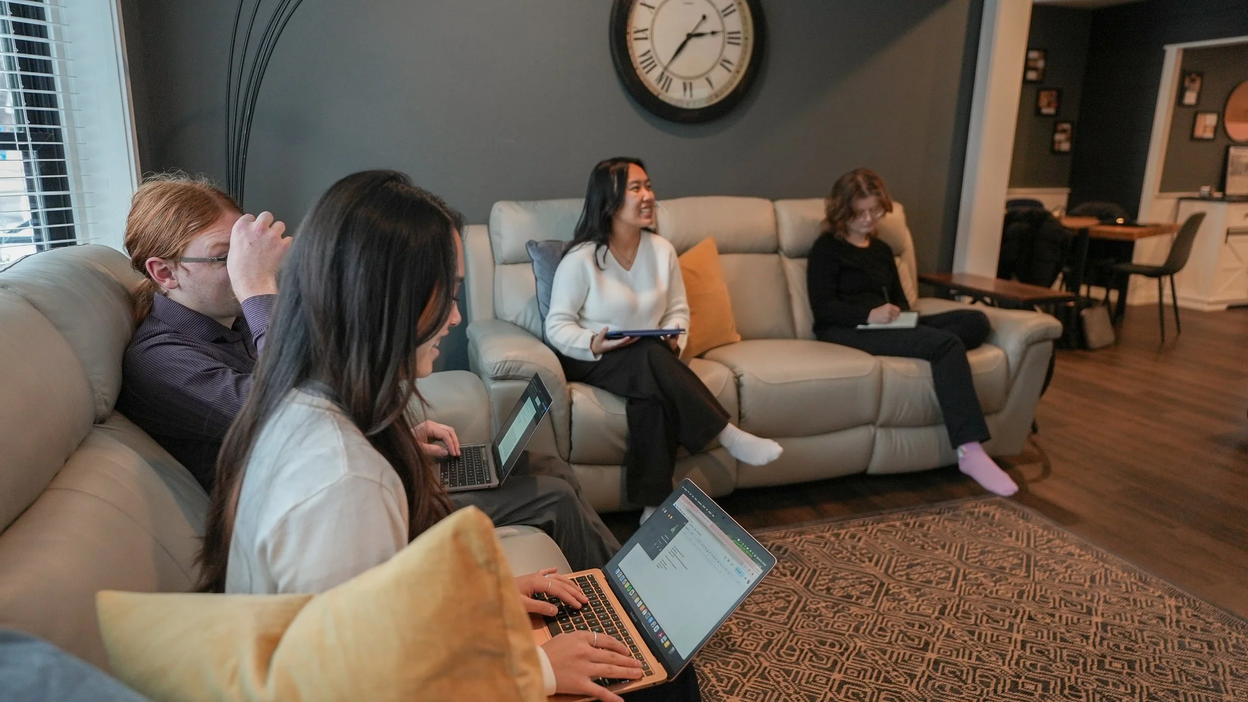 group of people working in living room