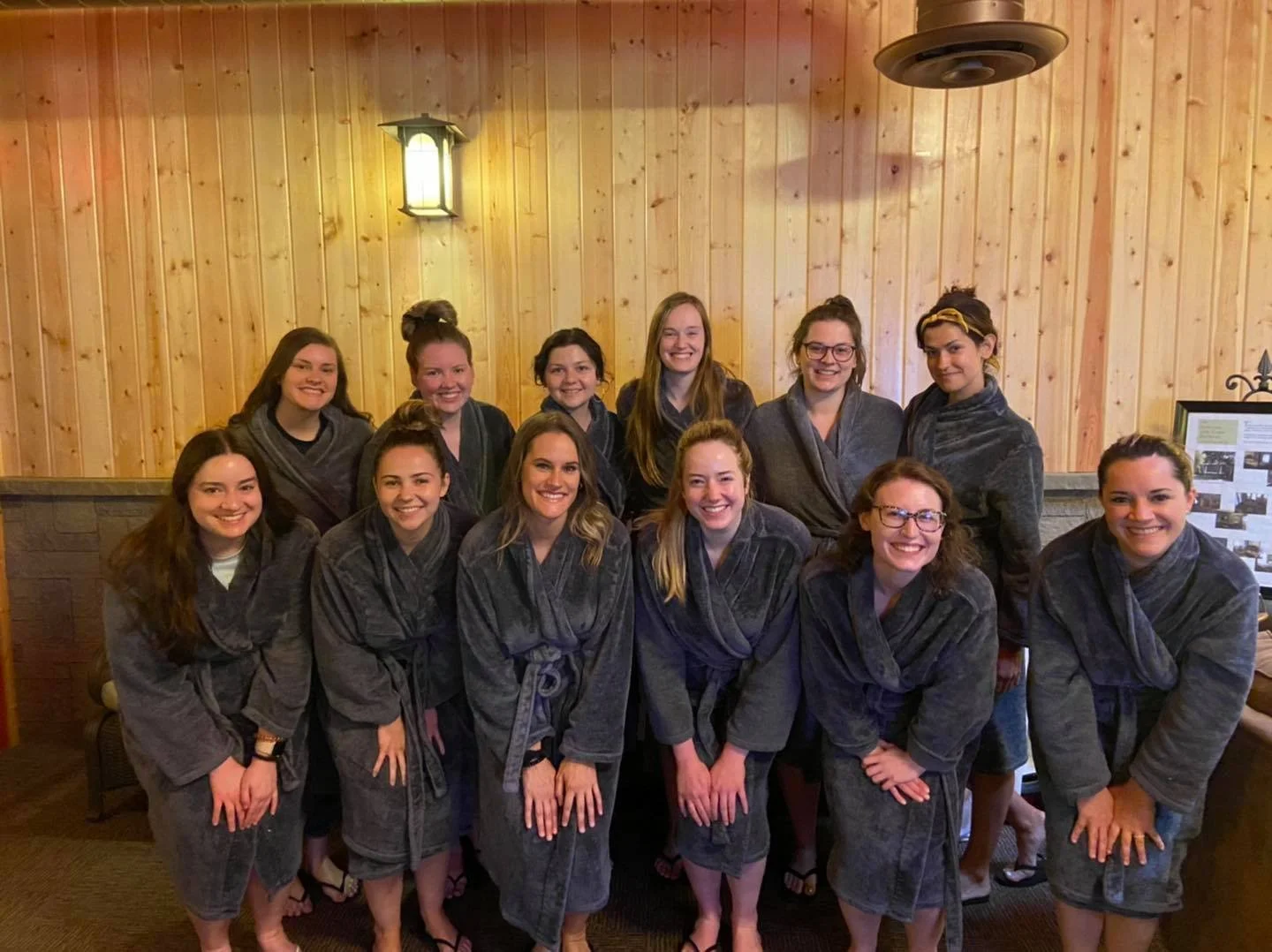 group of women in grey robes at spa