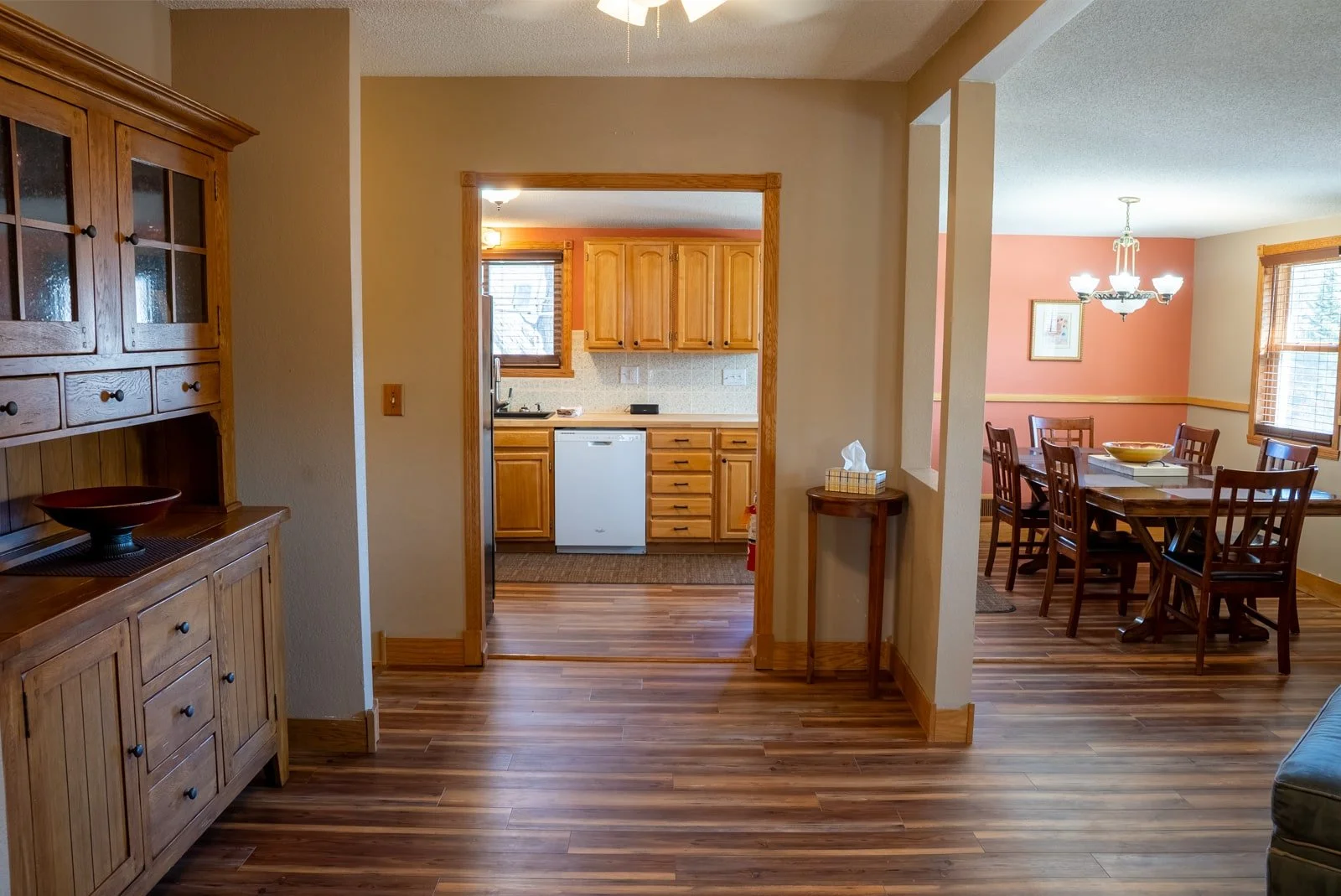 Backed up view of the dining room and the kitchen in The Retreat Home