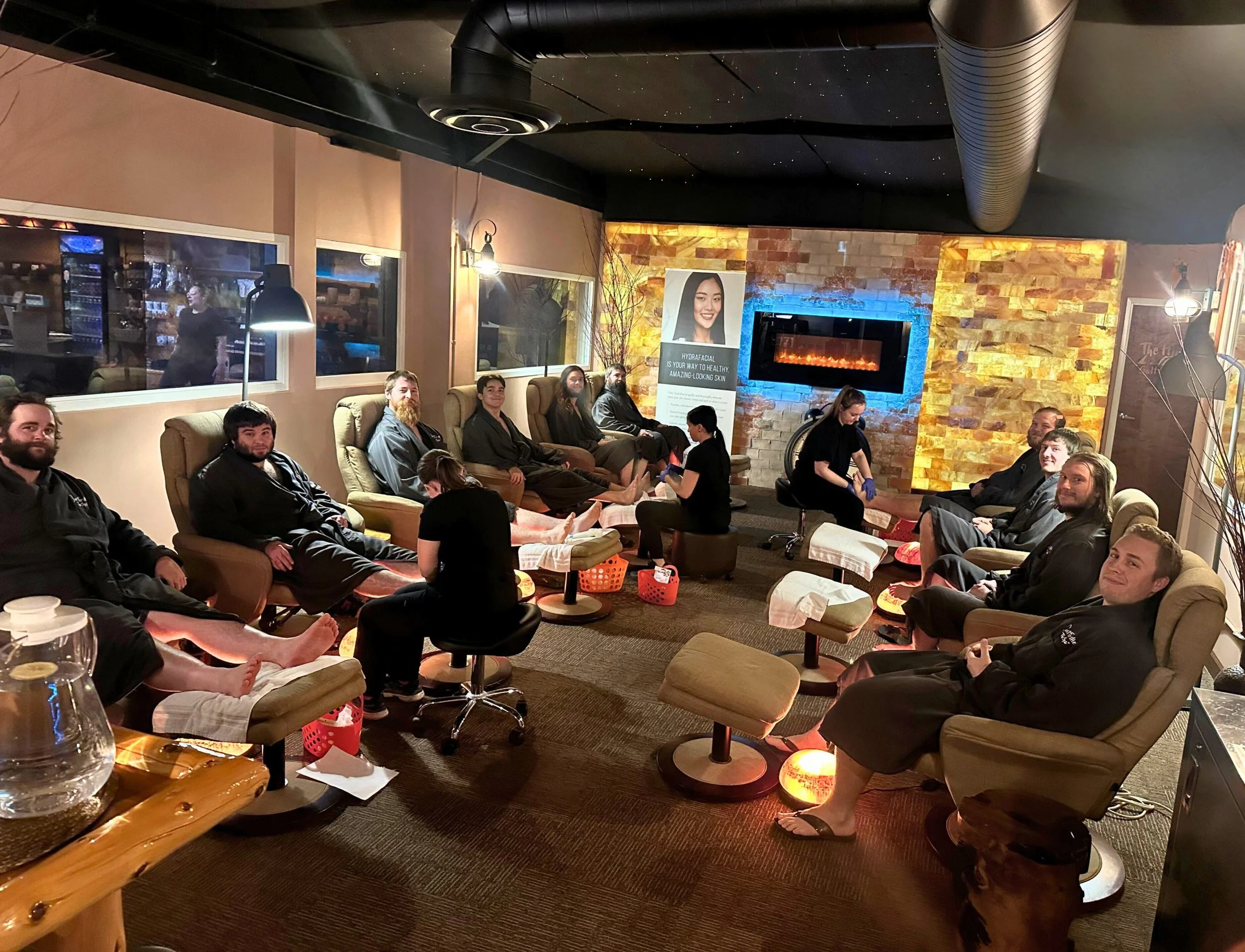 group of people receiving pedicures at spa