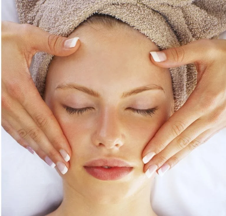 woman receiving spa facial
