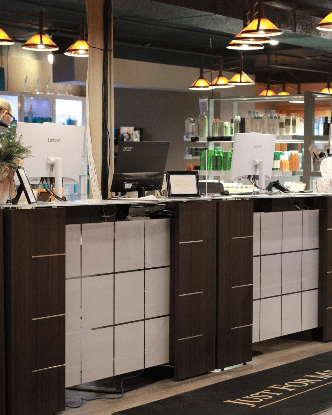 front desk of Just For Me Spa with 3 computers