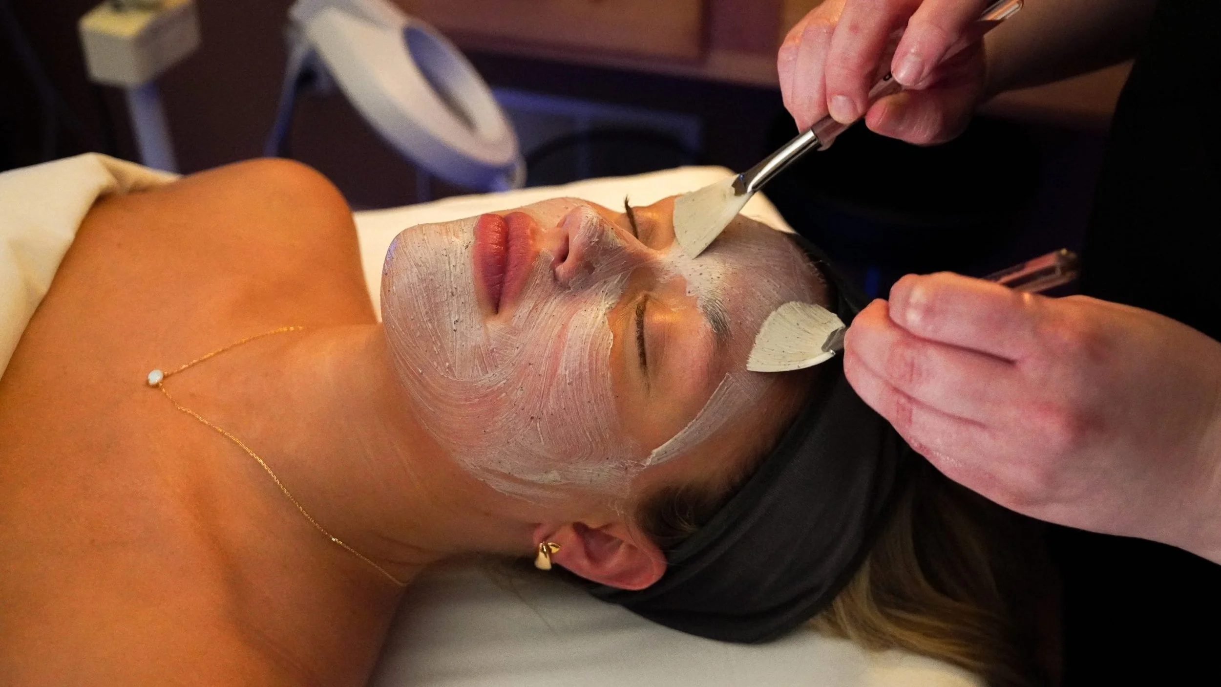 woman receiving facial