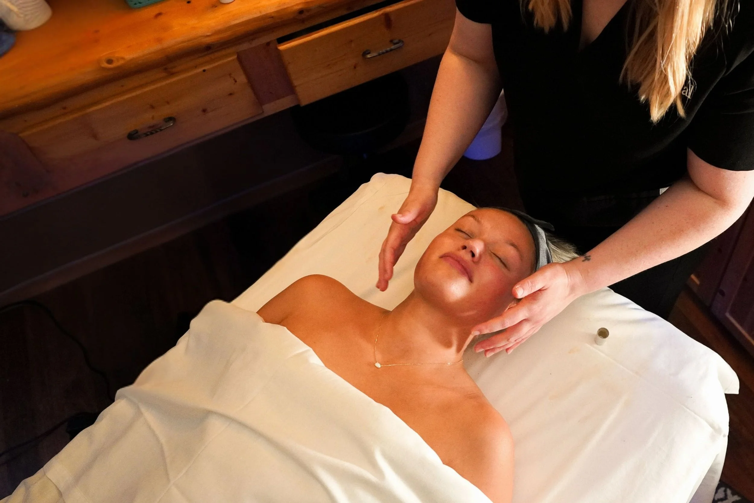 woman lying on back receiving massage