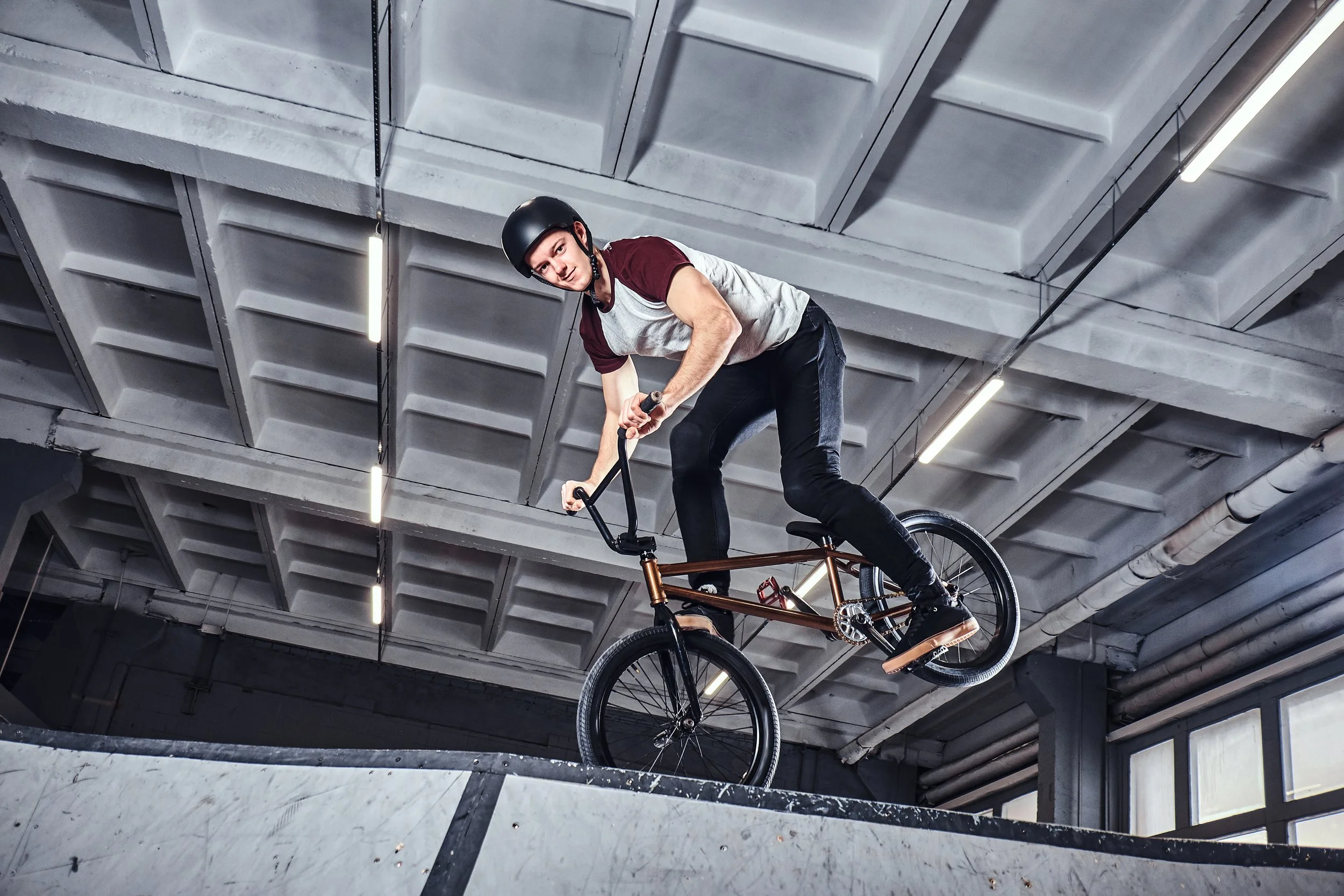 young-man-with-bmx-performing-tricks-in-skatepark-2025-01-25-16-10-45-utc.jpg