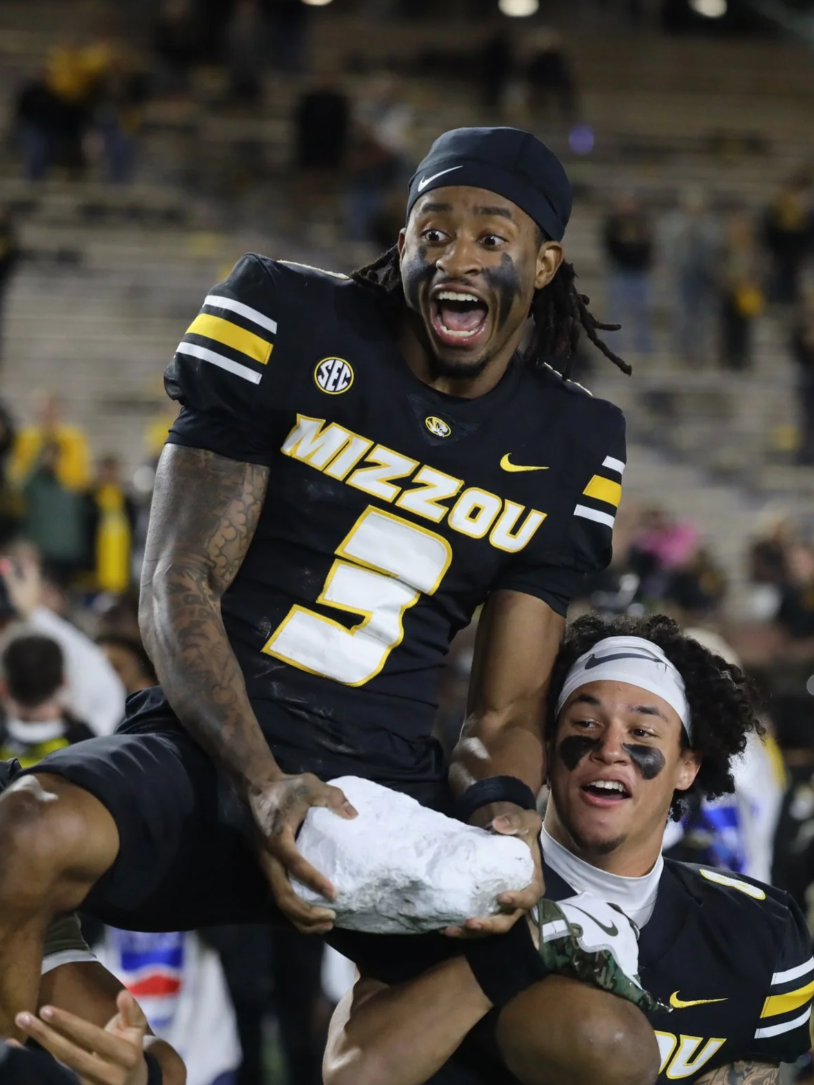 Mizzou wide receiver Kevin Coleman Jr. (3) gets lifted and carried off the field after winning his final home game Saturday at Memorial Stadium in Columbia. It is a Mizzou tradition if the Tigers win the final home game.