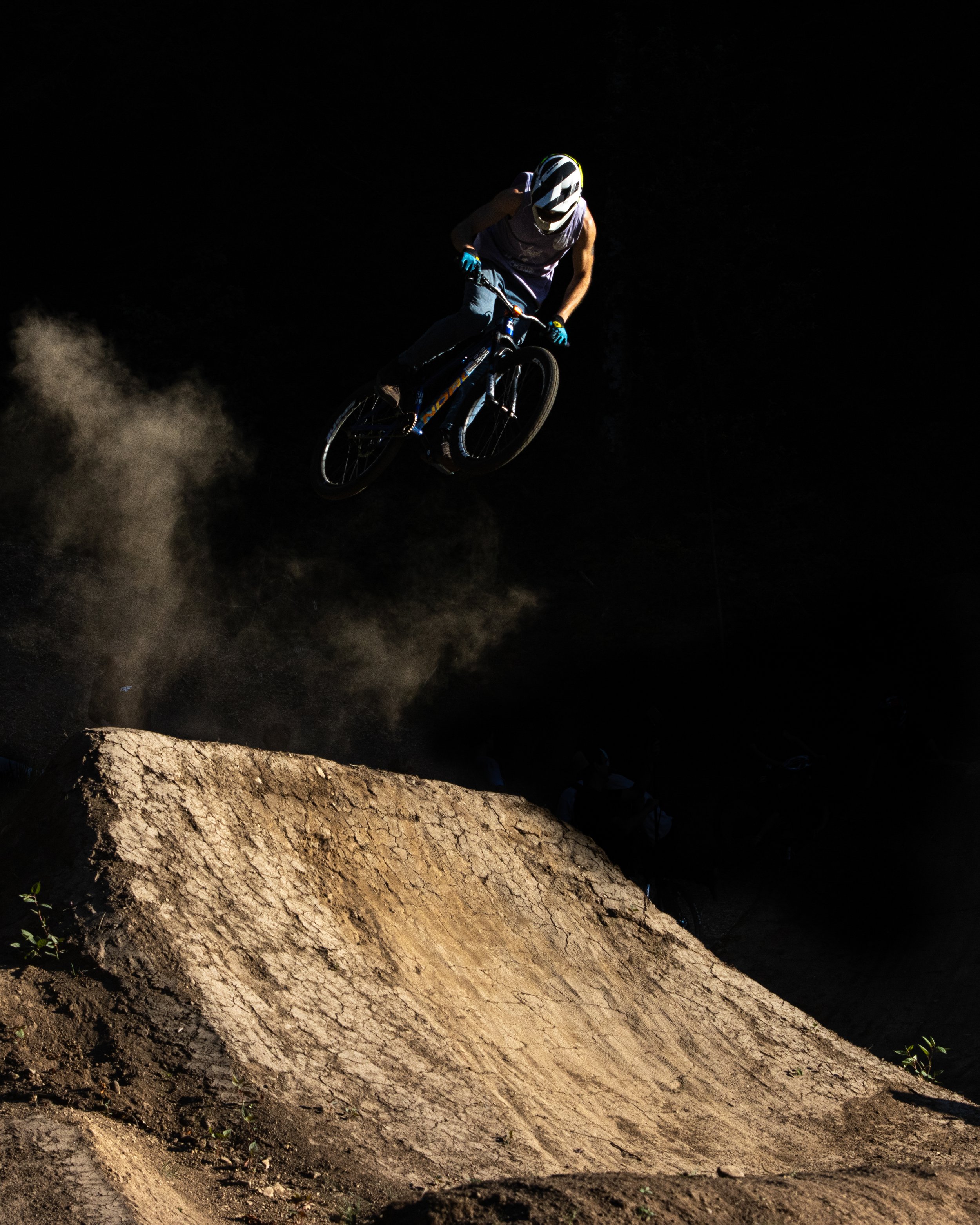 A mountain biker clears a jump during the High Cascade Photo Workshop on July 15, 2021, in Government Camp, Oregon.