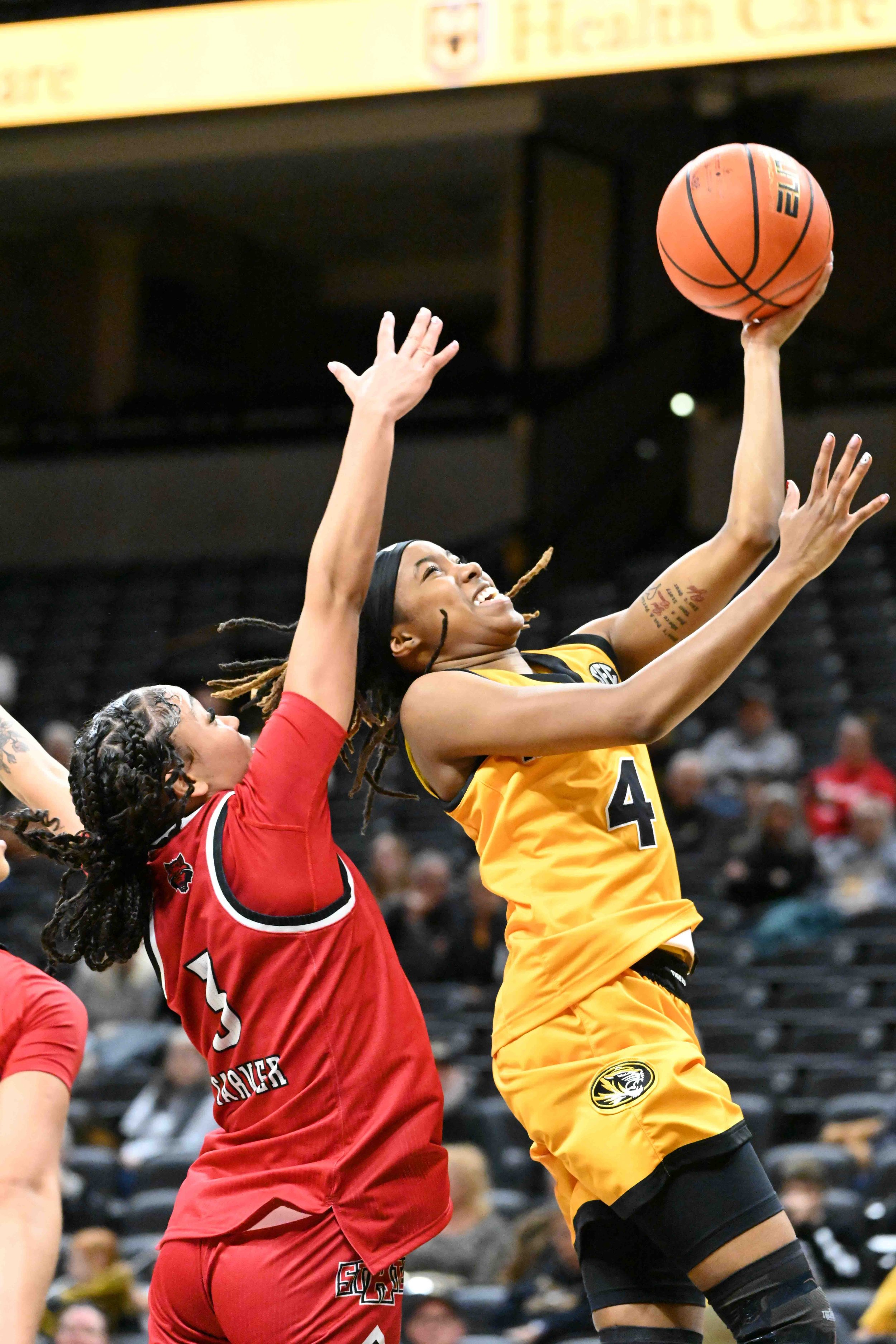 Missouri’s Lisa Thompson (4) attempts a layup against Arkansas State’s Mia Traver during the second half of a game on Tuesday, Nov. 11, 2025, at Mizzou Arena in Columbia. The Tigers will travel to Kansas City on Saturday to face rival Kansas.