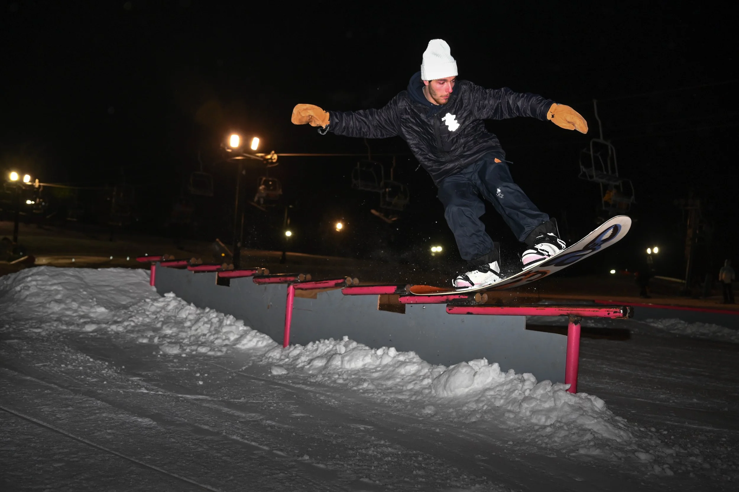 Dominick Otero tail presses a waterfall rail during Hidden Valley Ski Resort's rail jam on Friday, Feb. 21, 2025.  