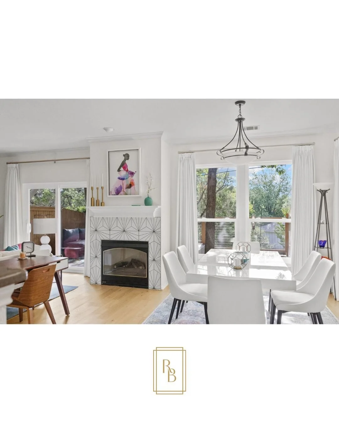 A bright, breezy downstairs in an open-concept living and dining area inside a condominium we designed for a client in Southwest Austin. Behind the sofa, a compact desk creates an extra workstation&mdash;giving her a convenient spot to work downstair