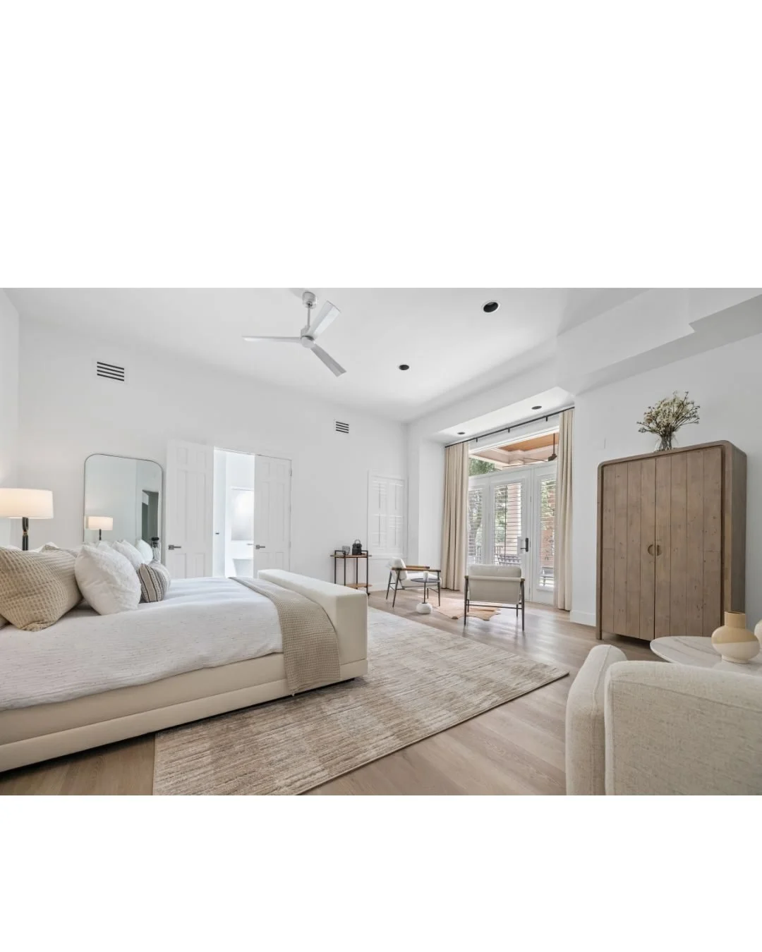 The oversized guest suite on the main floor sits just to the left of the staircase, giving it a sense of separation and privacy&mdash;ideal for visitors staying a week or two. It&rsquo;s generously scaled, with enough room to include a full sitting a