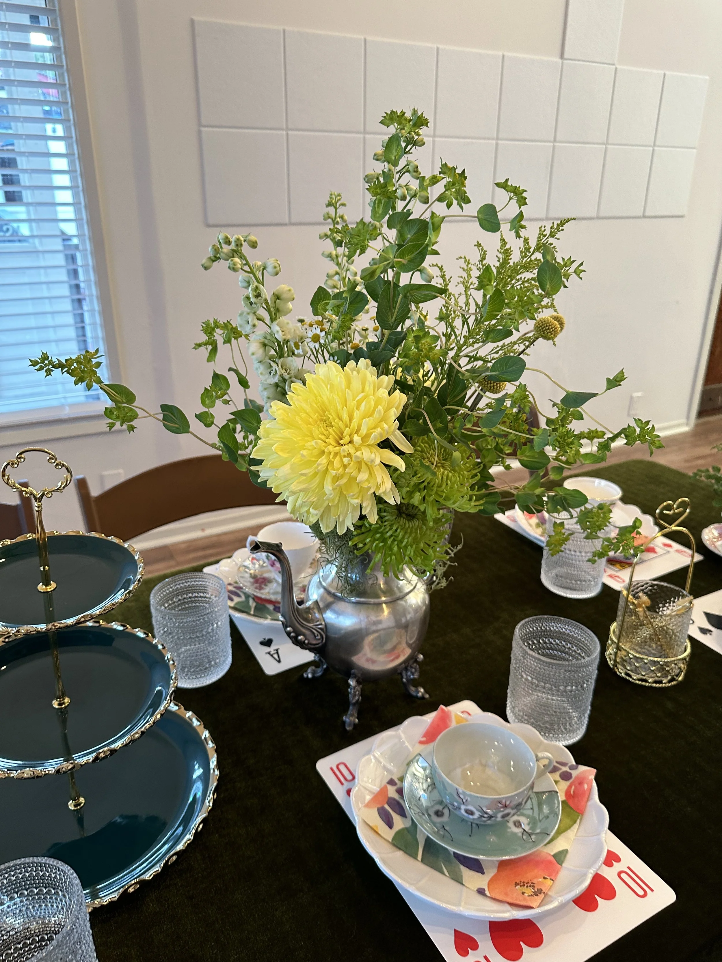 Fancy high tea tablescape with playing card placemats