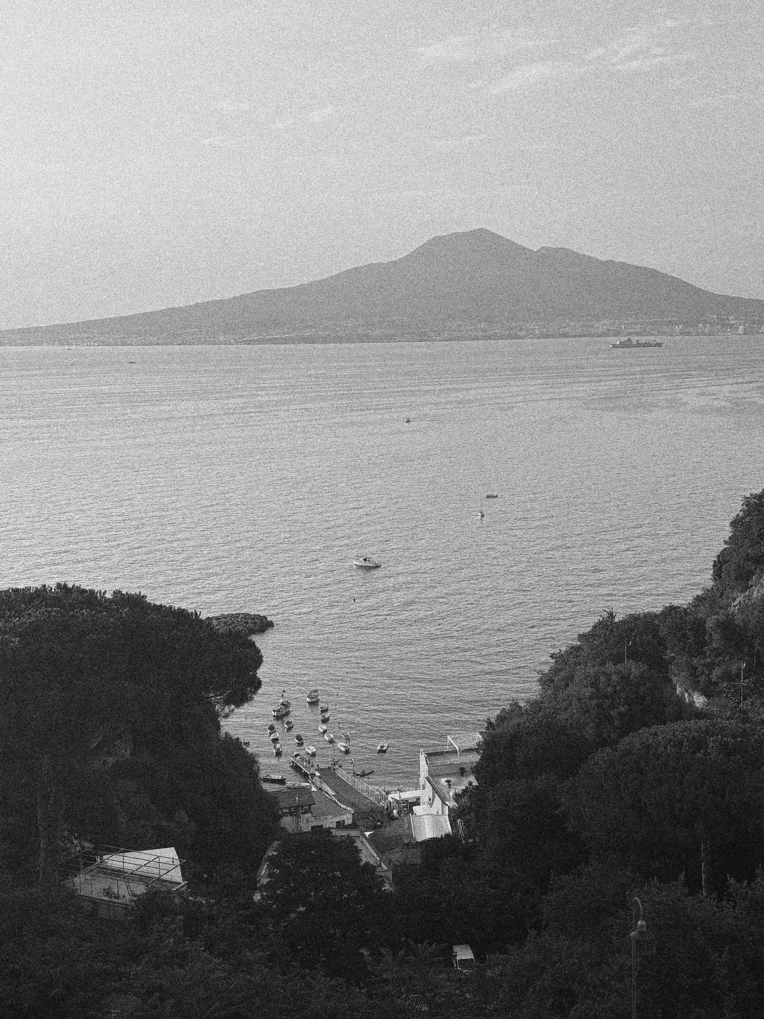 MOUNT VESUVIUS FROM THE COAST AT SUNSET IN VICO EQUENSE, ITALY