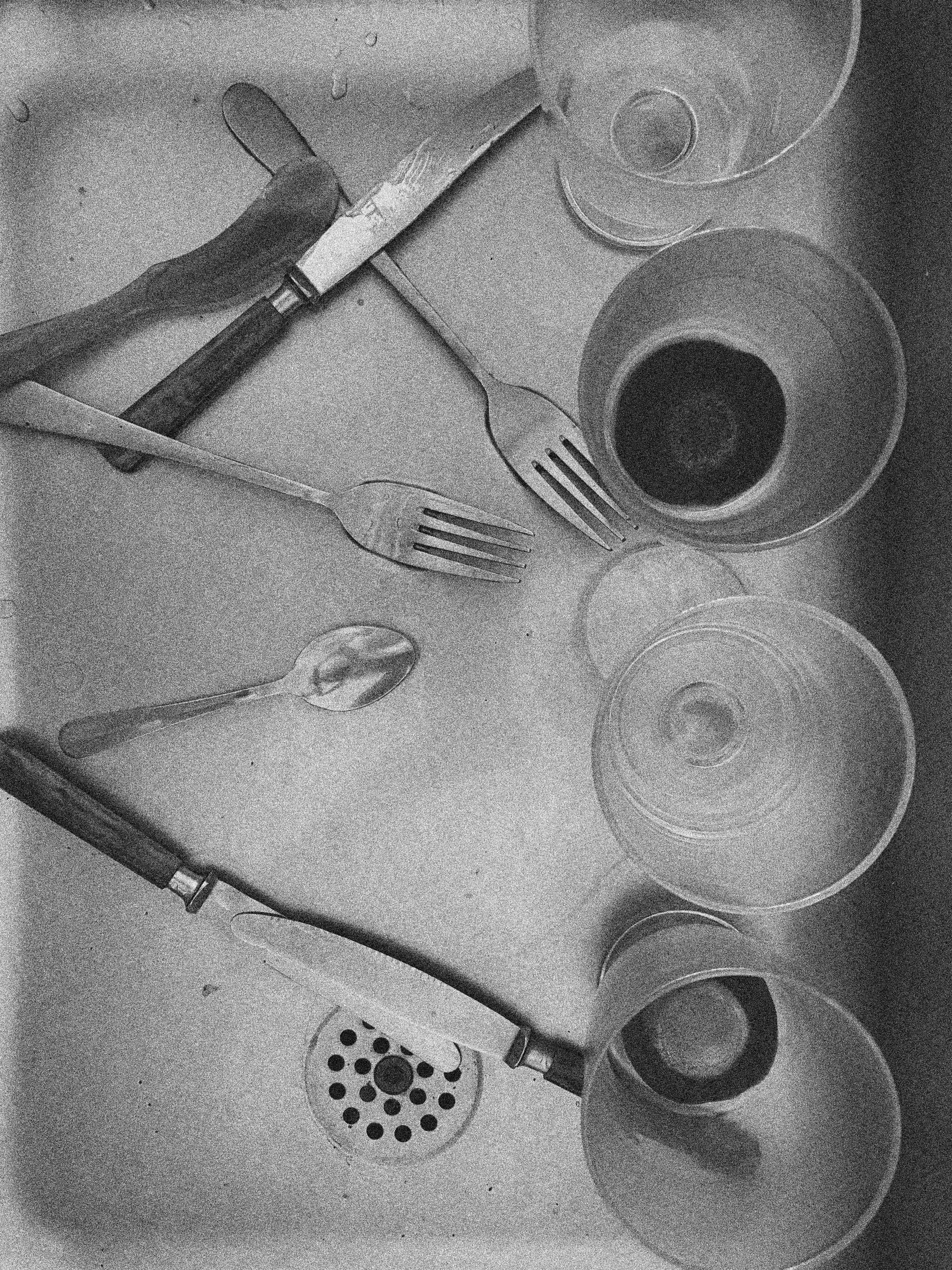 DIRTY DISHES IN THE SINK IN COPENHAGEN, DENMARK