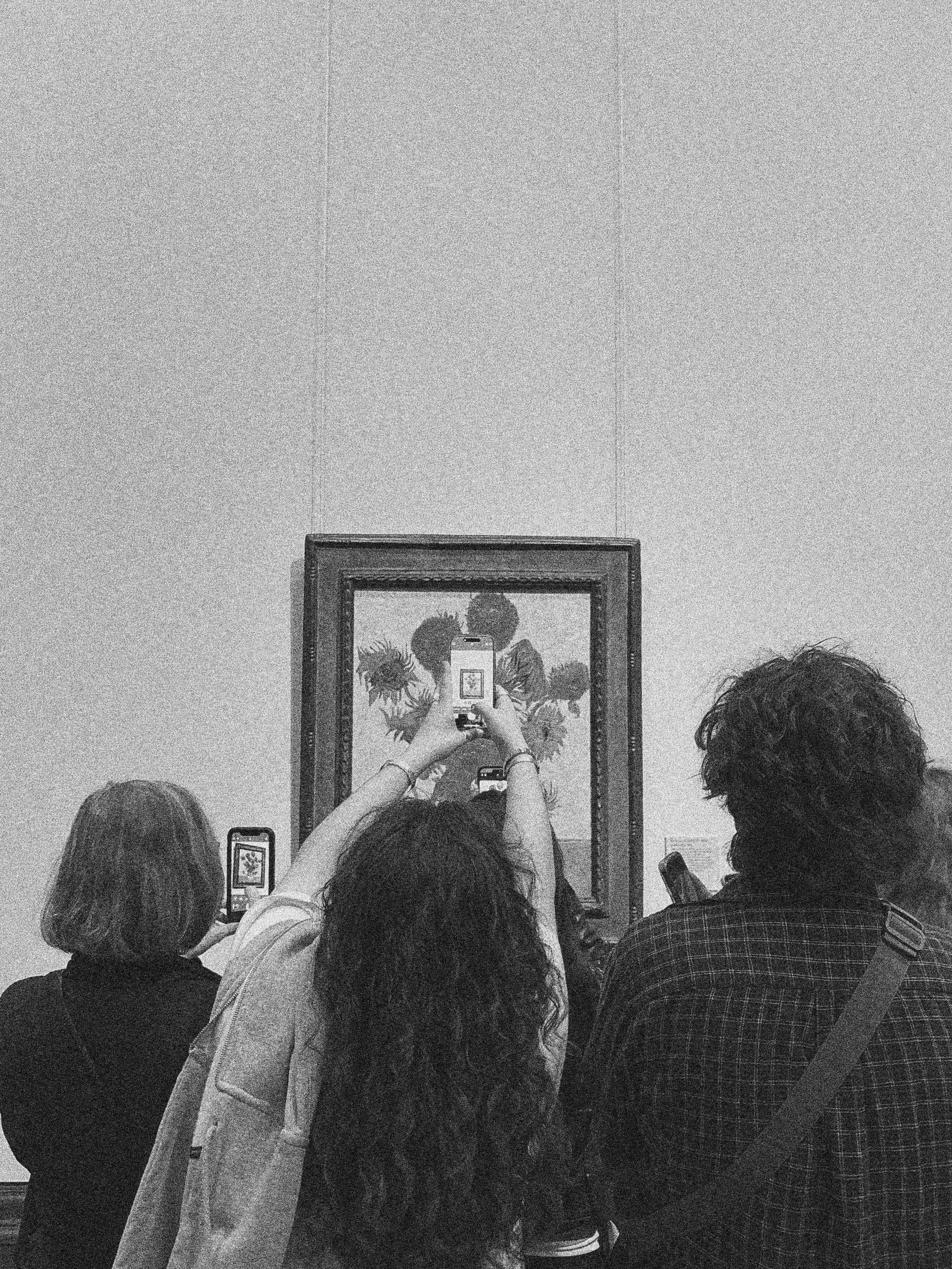 A PHOTOGRAPH OF A PHOTOGRAOH OF SUNFLOWER BY VAN GOGH IN LONDON, ENGLAND