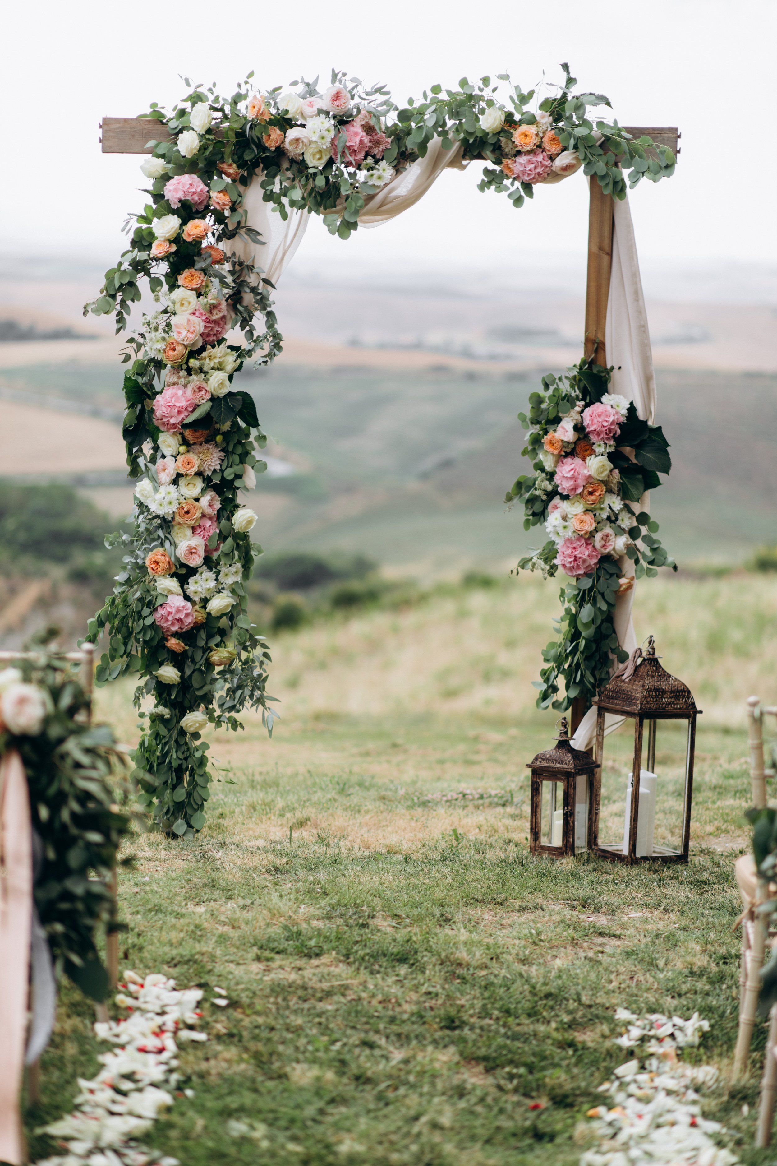 beautiful-archway-decorated-with-floral-composition-outdoors.jpg