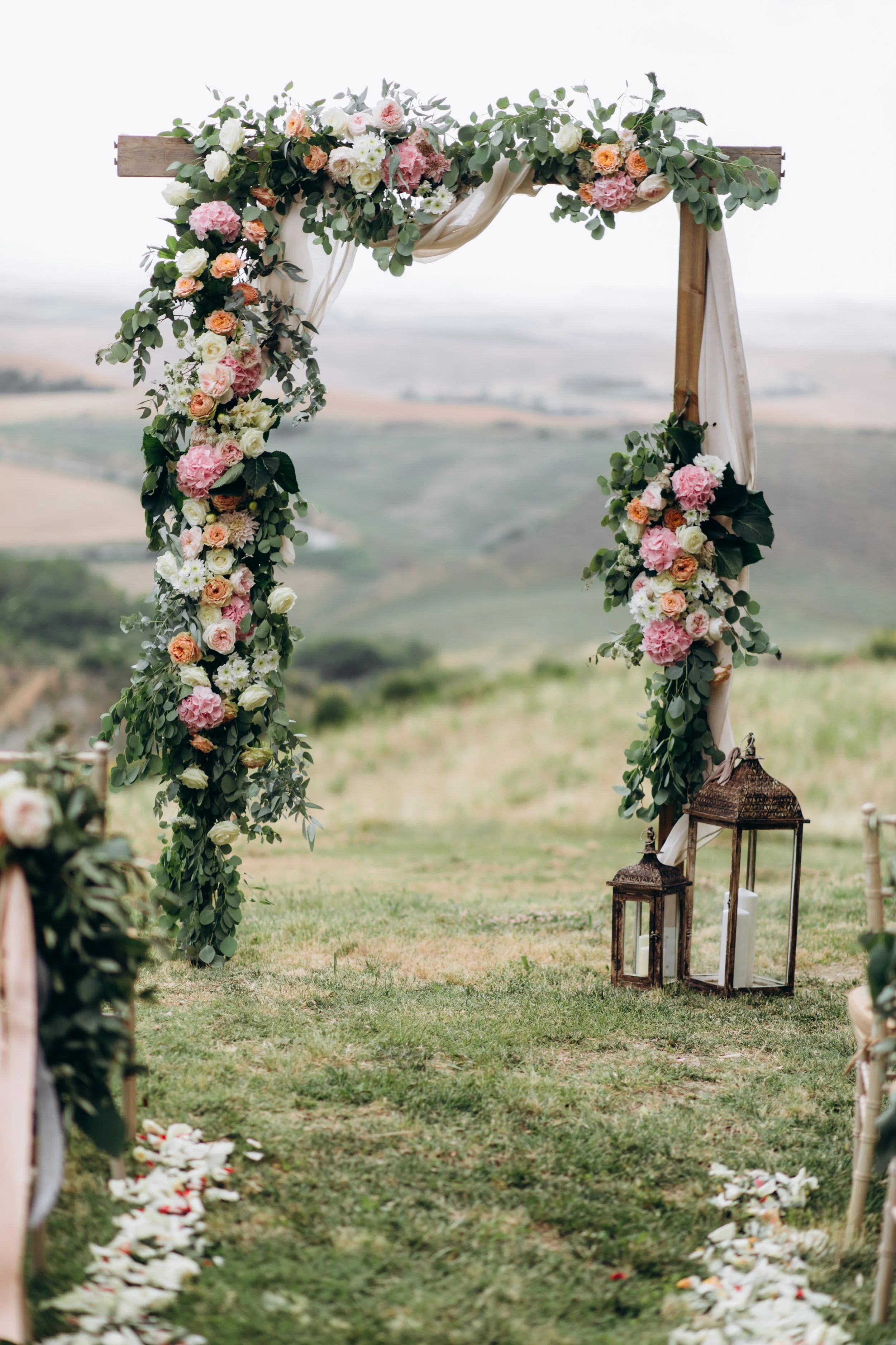 beautiful-archway-decorated-with-floral-composition-outdoors.jpg