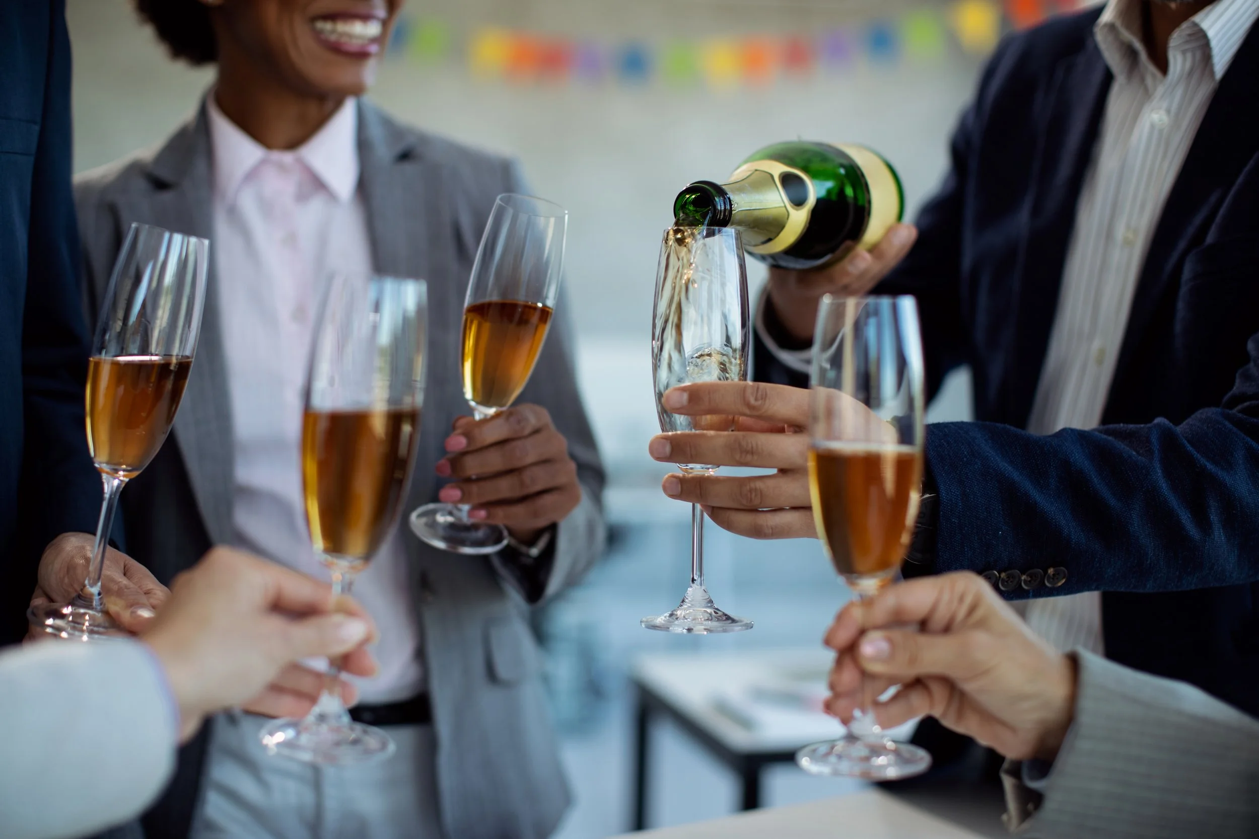 closeup-business-team-drinking-champagne-office-party.jpg