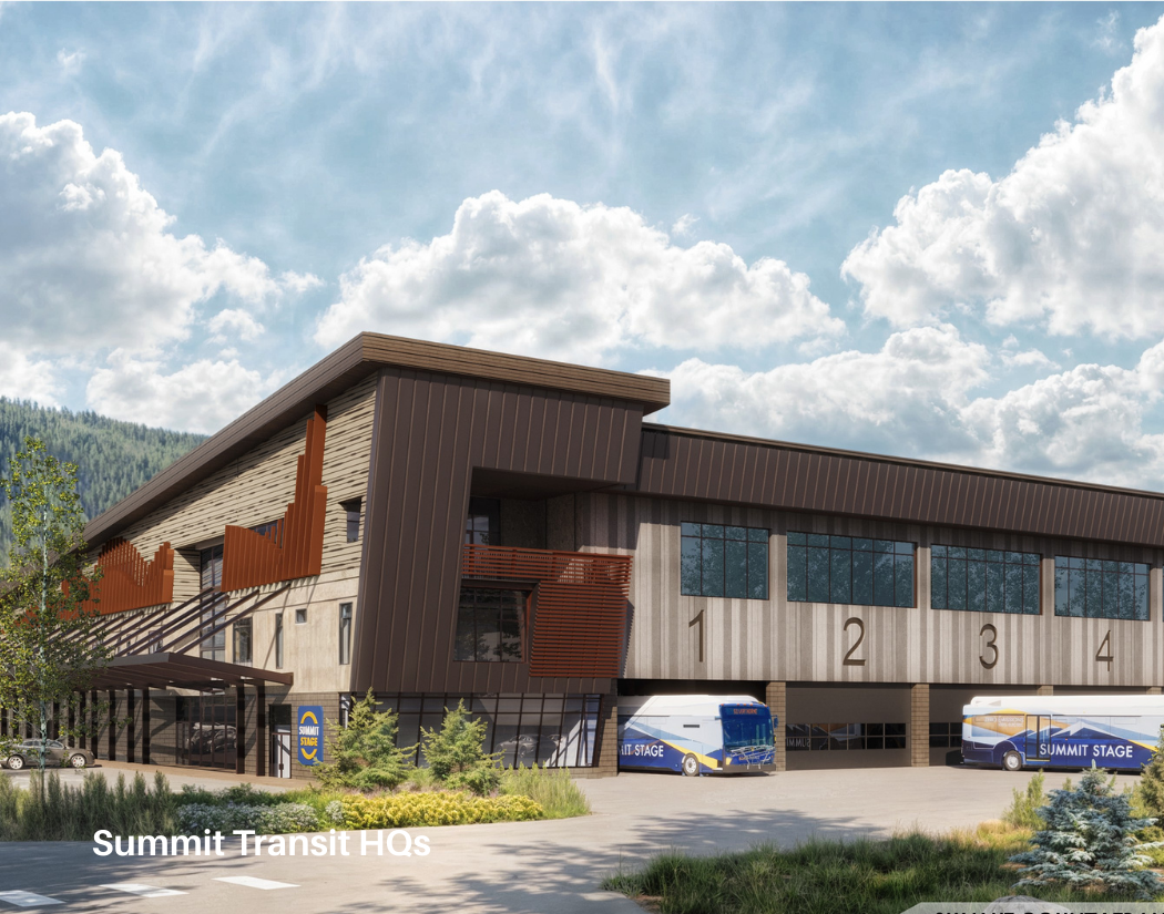 Rendering of Summit Transit Headquarters with a modern, multi-story building, bus bays, and buses parked outside, surrounded by trees and mountains under a partly cloudy sky.