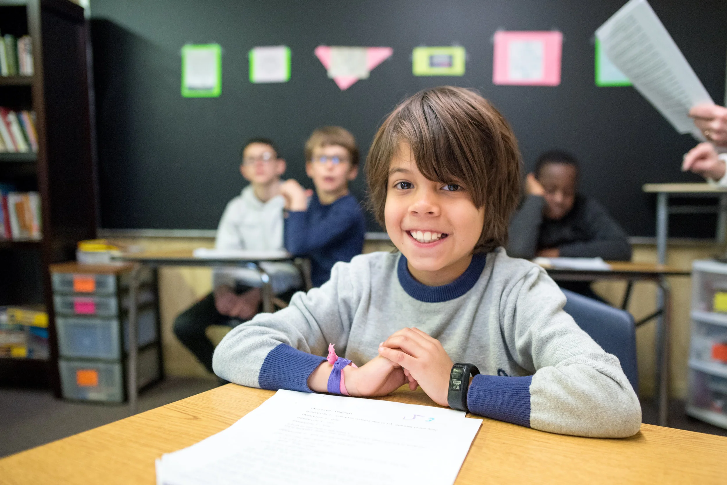 An Oakland School student sits patiently in class.