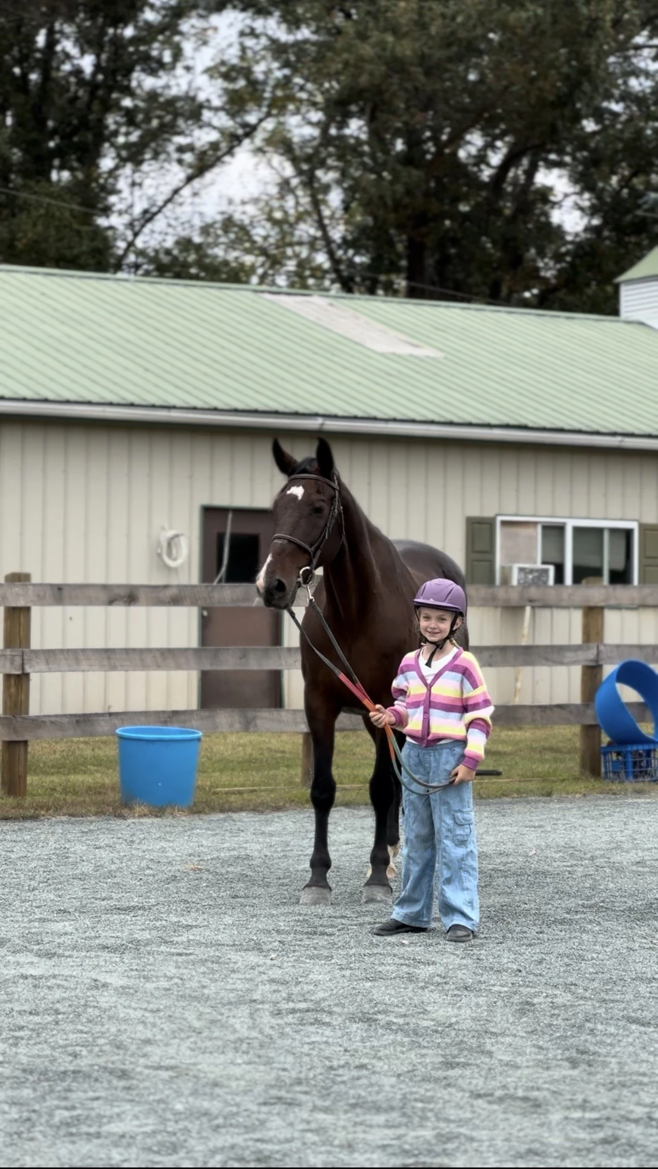 Oakland Student smiling with horse