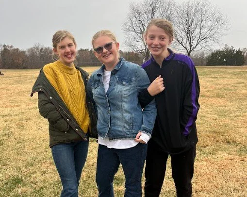 Three Oakland Students Smiling