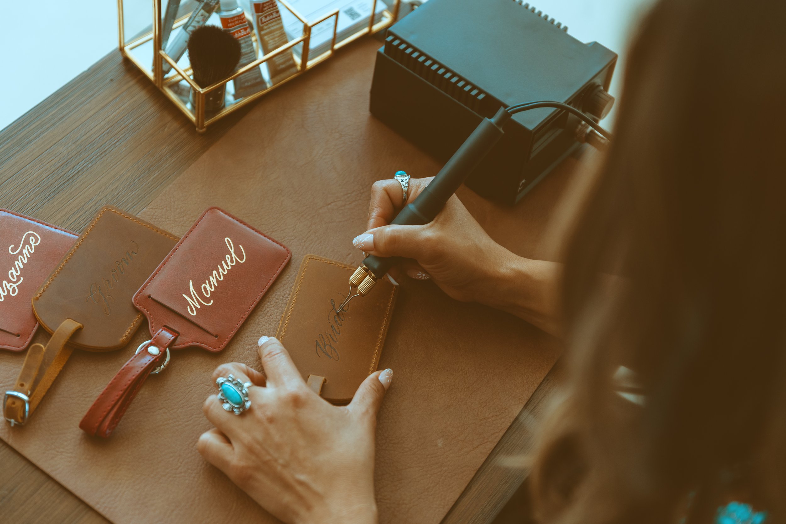 Leather branding, debossing, leather personalization, leather branding, hand lettering on leather, leather goods, leather gifts, leather personalized keychain, live personalization on leather goods, western personalization, warm rustic lettering