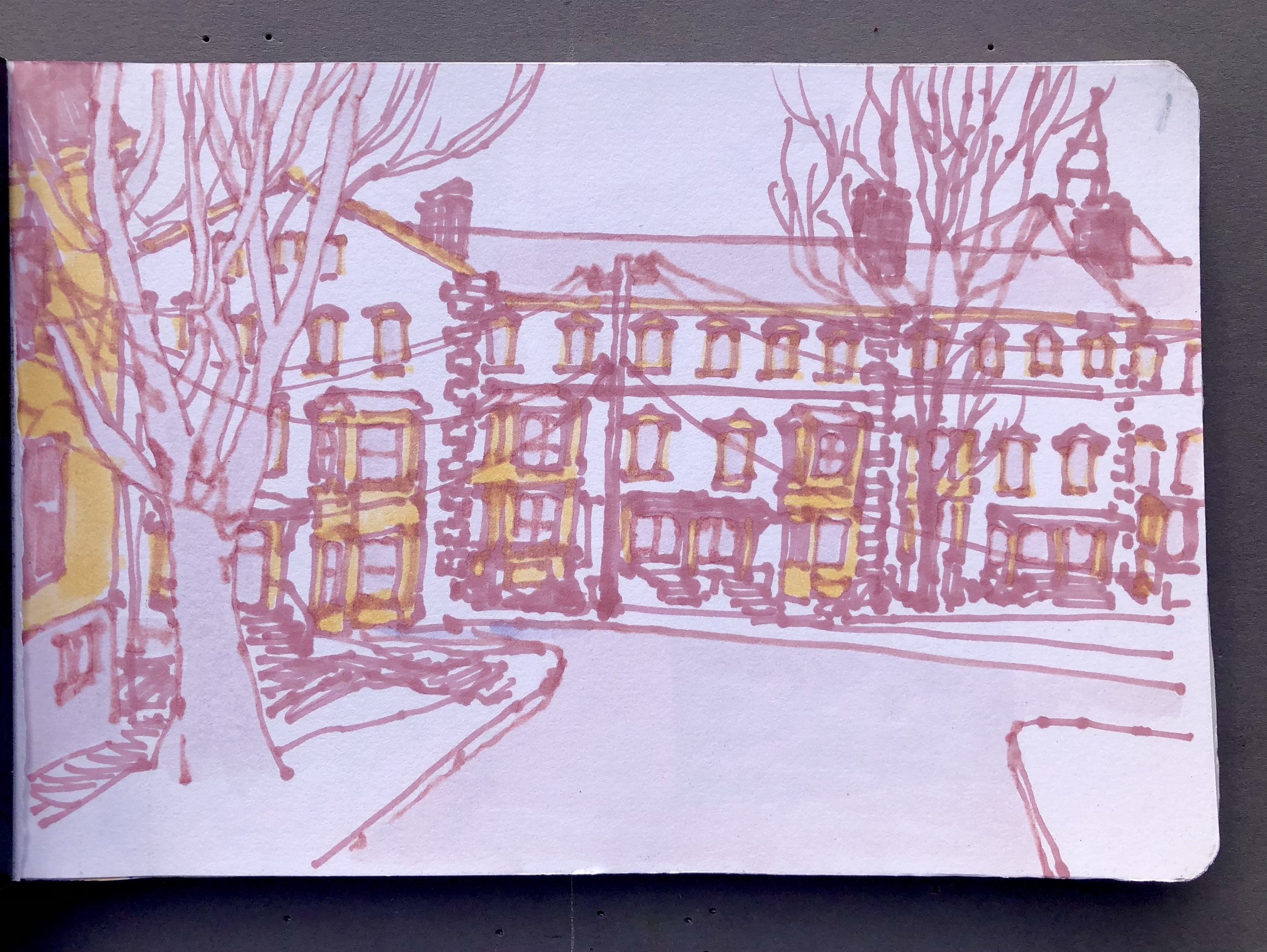 Sketch of a city street with residential buildings, trees, and power lines.