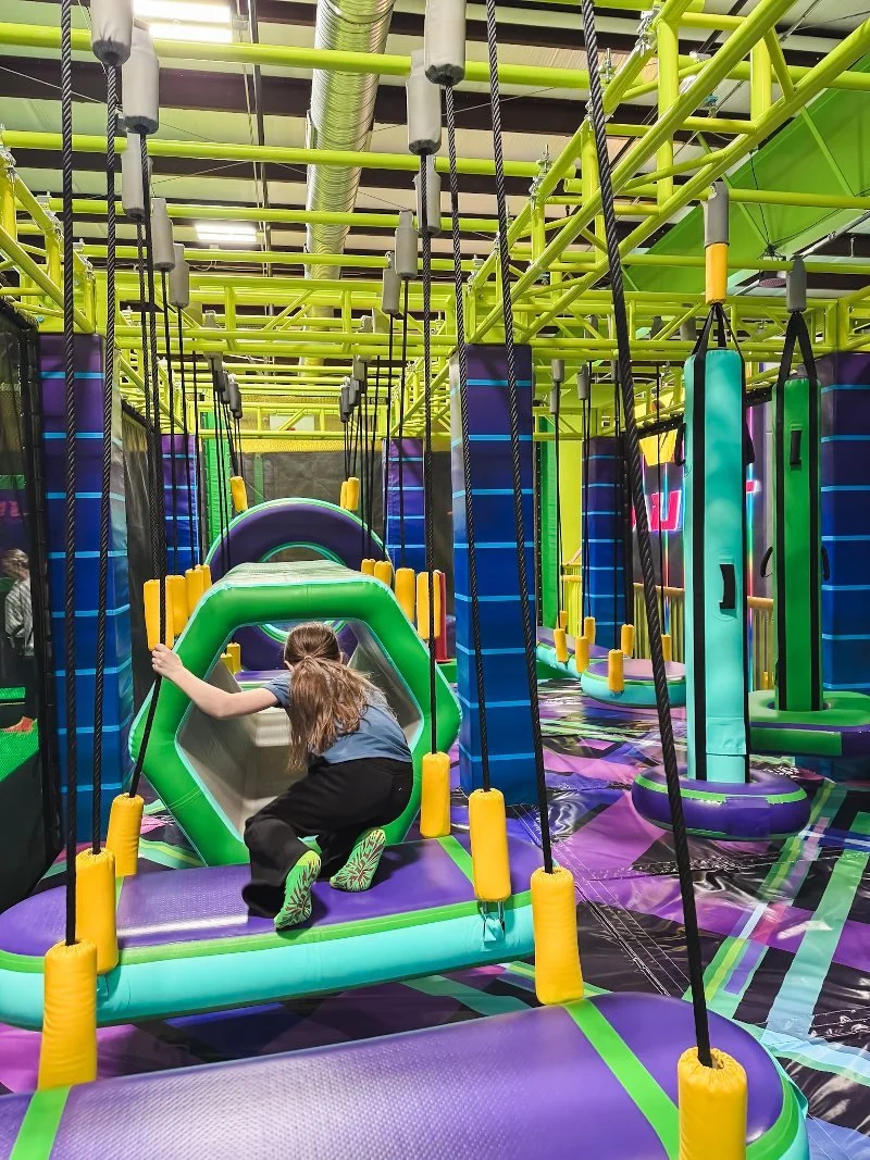 girl completing obstacle course at vault active play in harford county, maryland