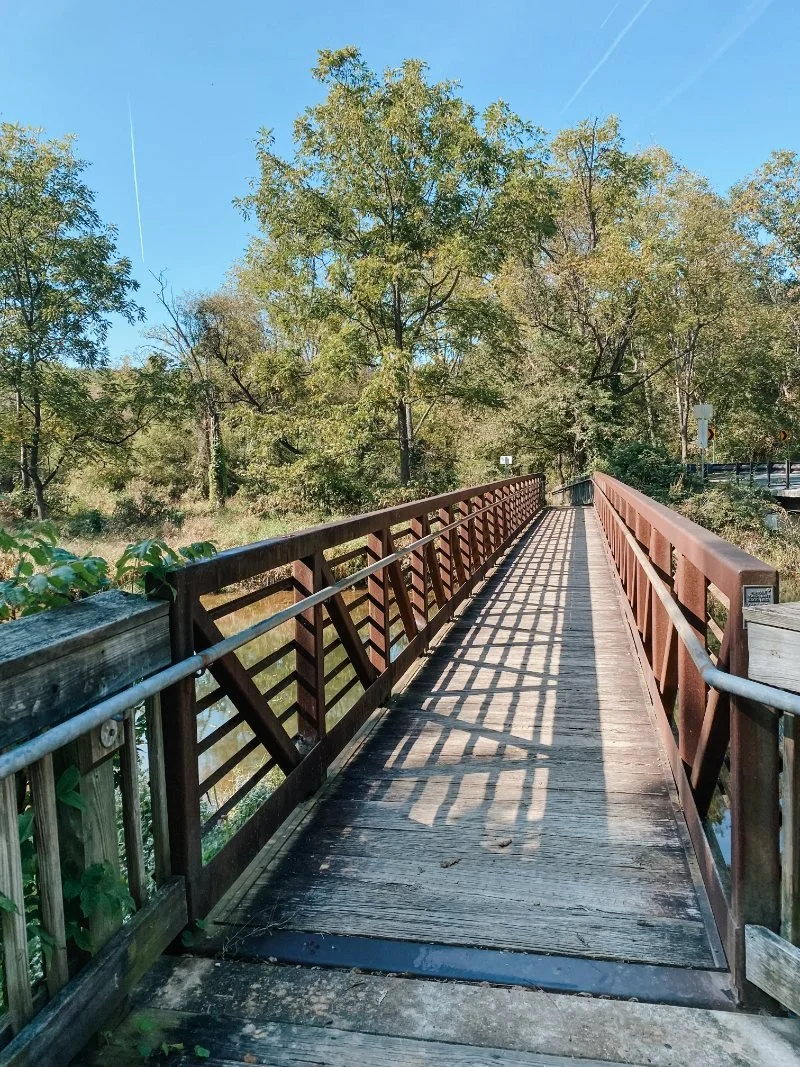 Trail bridge crossing over Deer Creek to connect to more trails at Eden Mill Park in Pylesville, MD