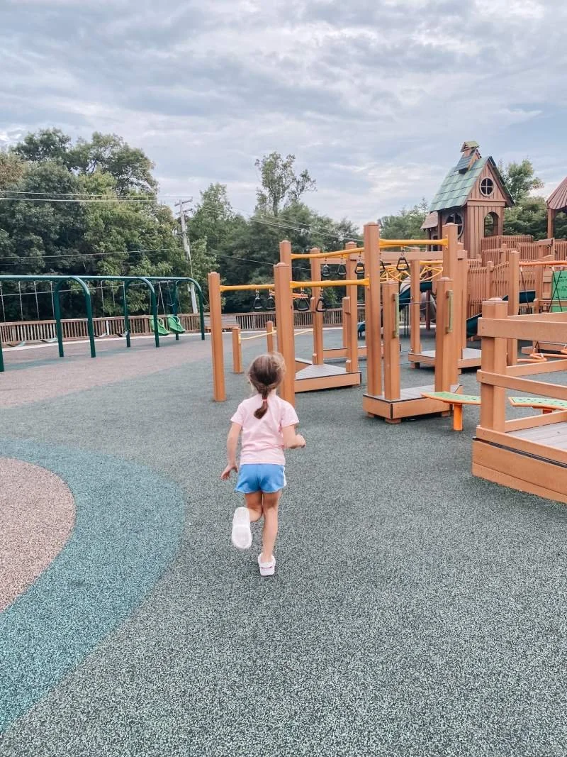 getz-playground-bel-air-md-girl-running-on-rubberize-surface.jpeg