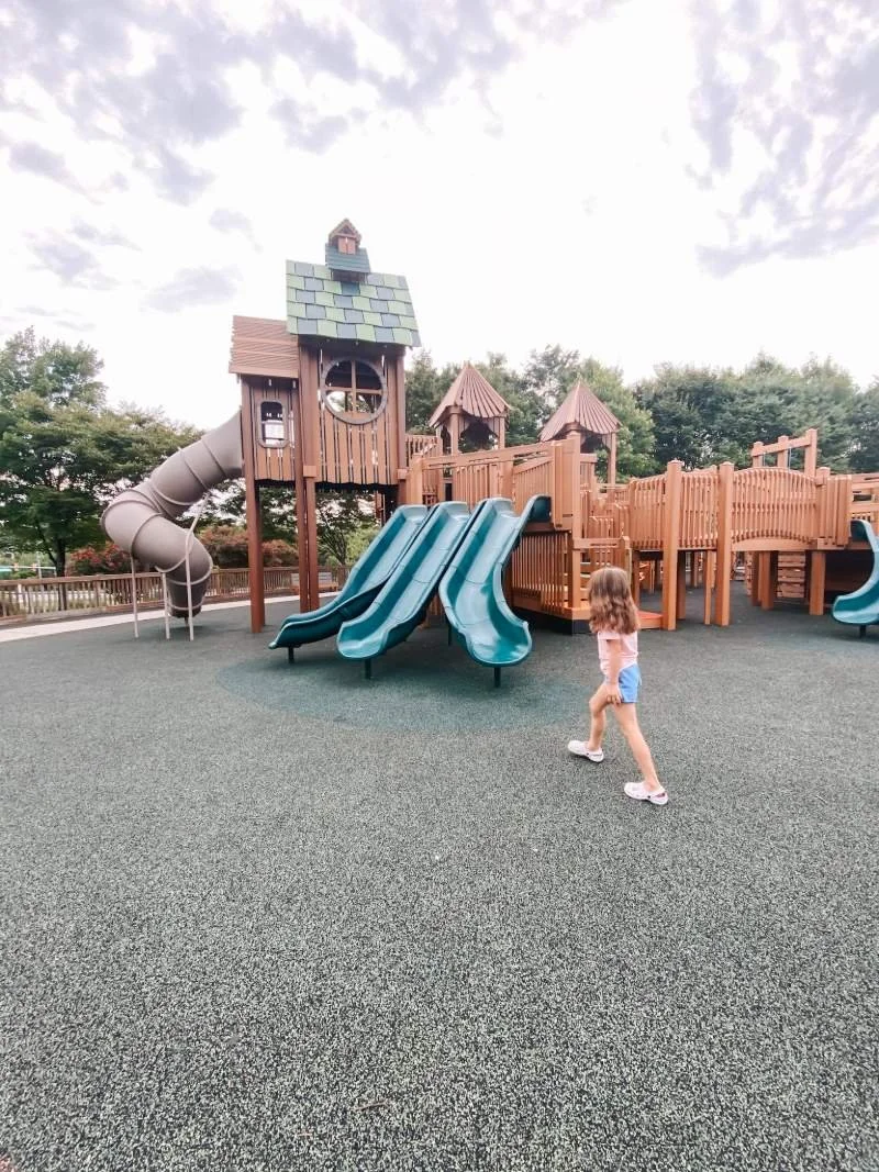 getz-playground-bel-air-md-girl-walking-towards-open-slides.jpeg