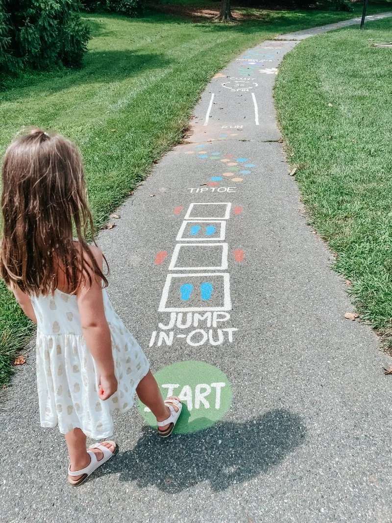girl walking the sensory trail at the abingdon library in harford county maryland