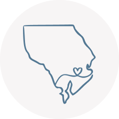 The Harford County Mom circular icon of outline of Harford County, Maryland with heart inside representing her love of all things local