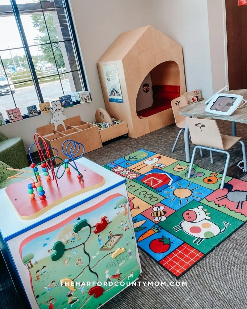 Darlington Library in Street, Maryland's children's section with games, play structures, reading nooks, and toys